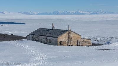Scott's Terra Nova Hut with McMurdo Sound and the Transantarctic Mountains in the background
